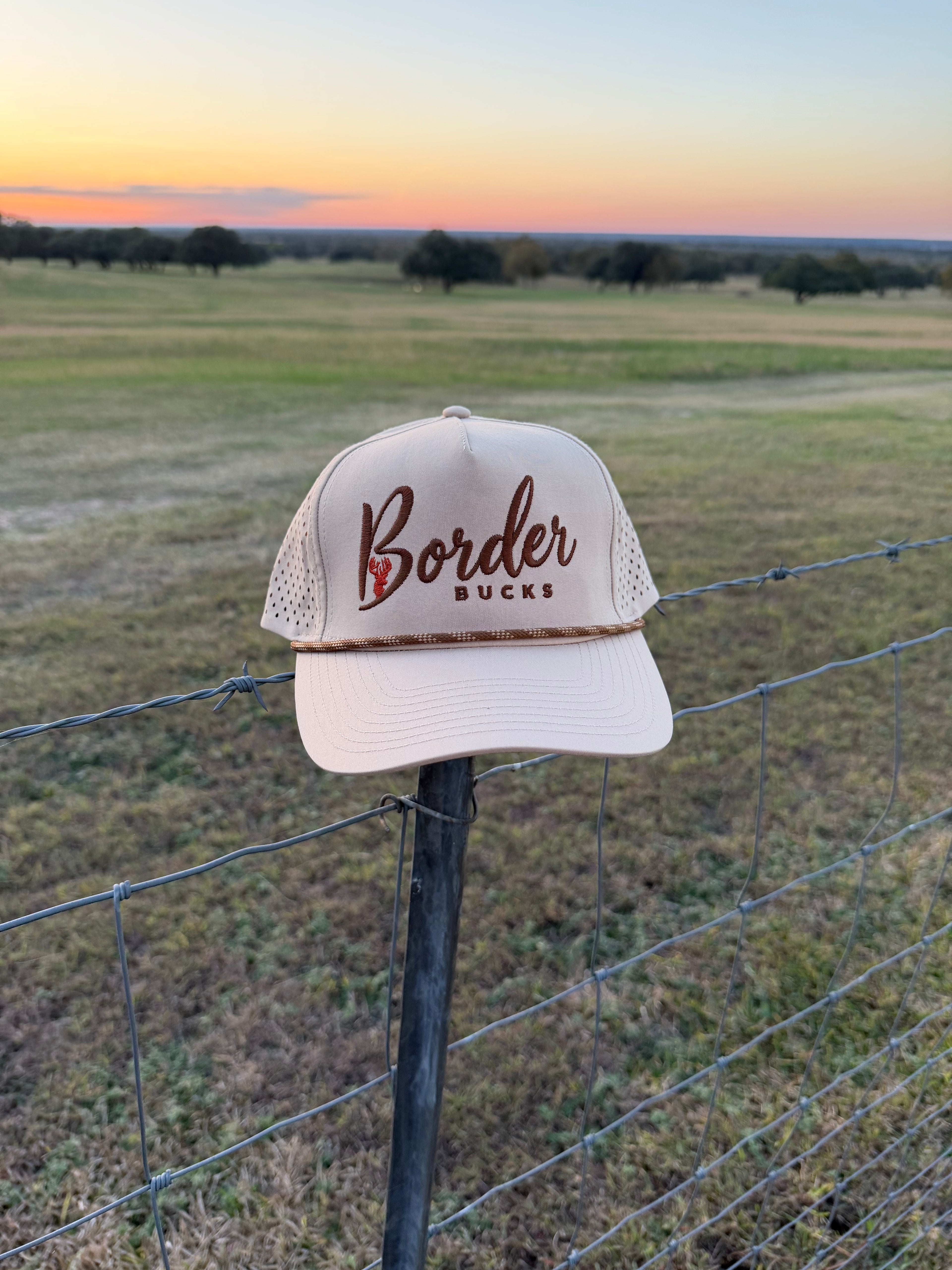 Tan rope hat with orange deer